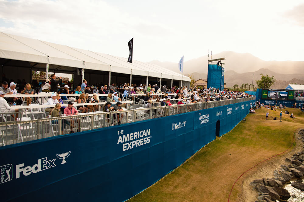 tent and stands along side of golf course