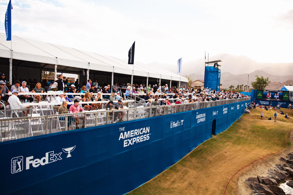 tent and stands along side of golf course