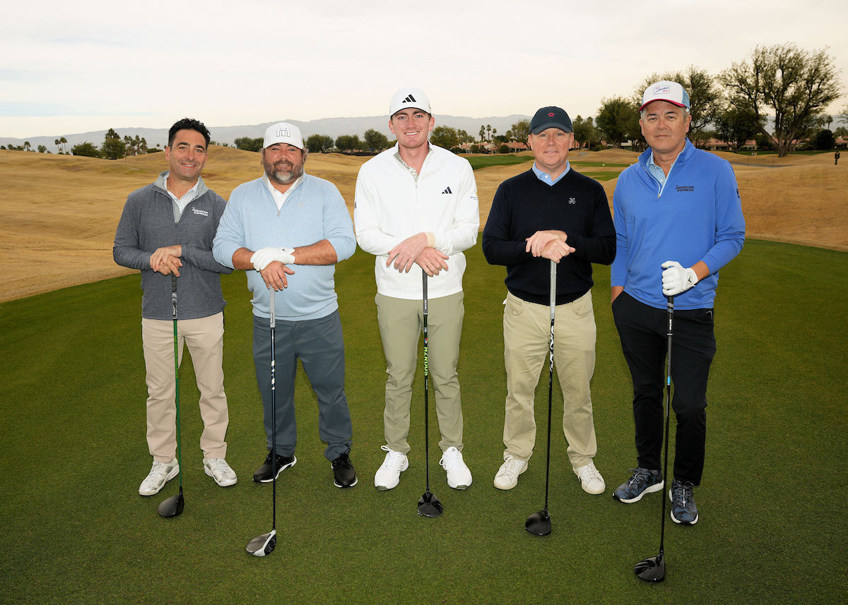 honorary observers standing on golf course