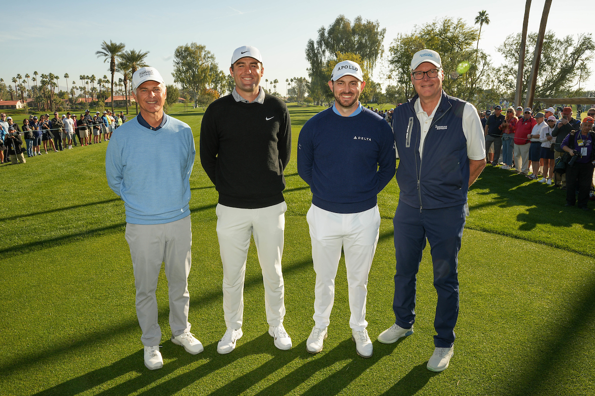 honorary observers standing on golf course